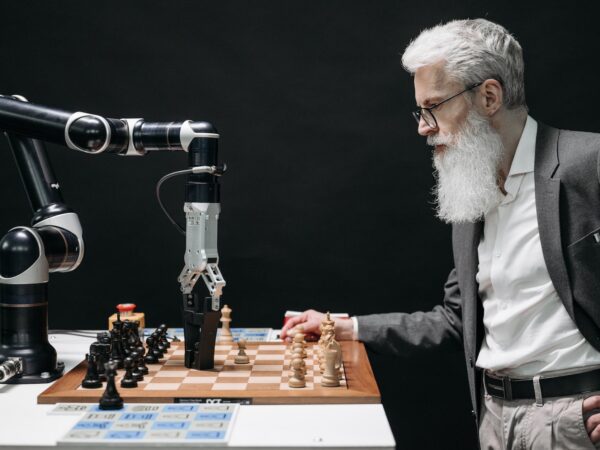 a bearded man playing chess