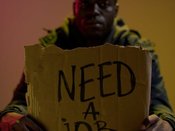 workless man holding cardboard