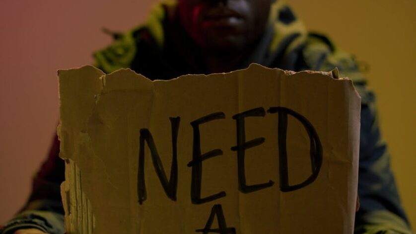 workless man holding cardboard