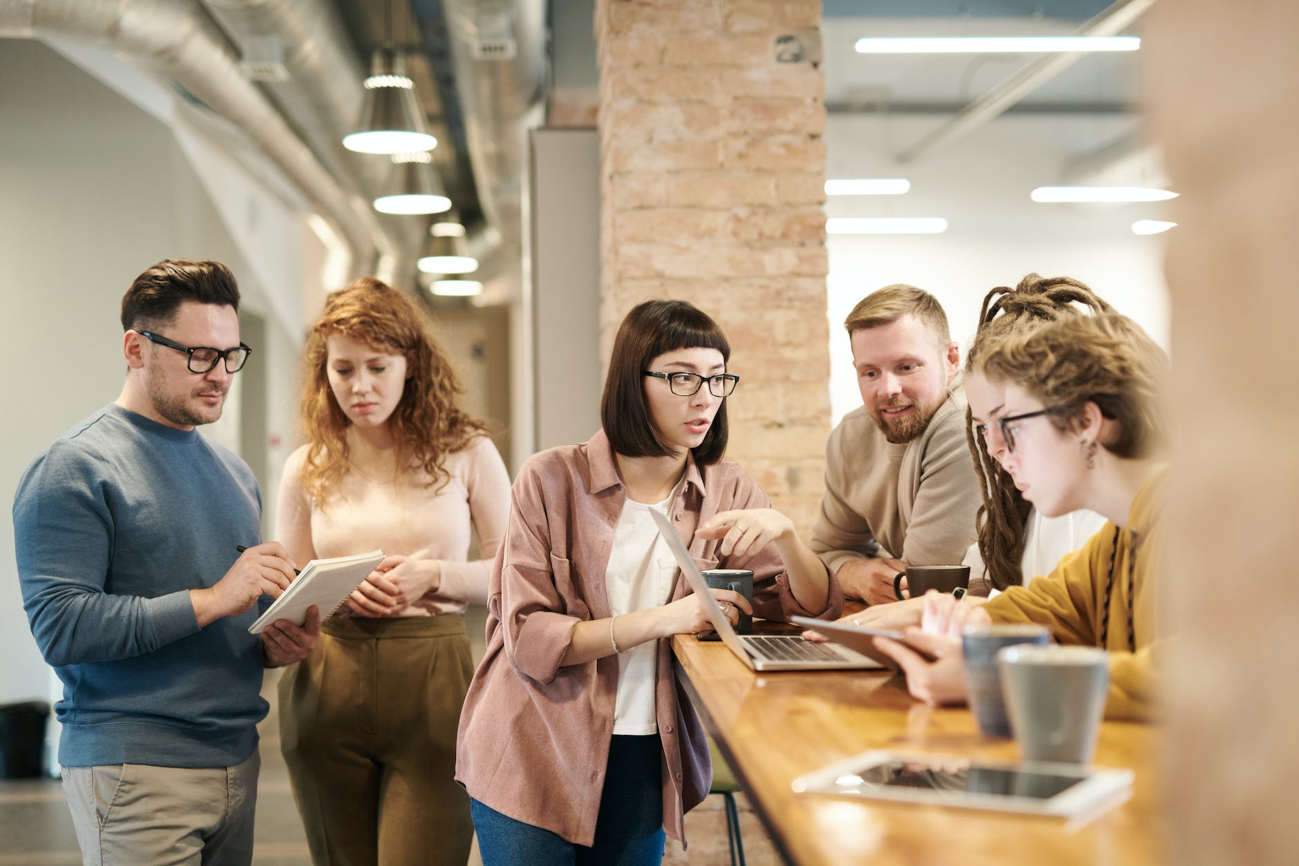 shallow focus photo of people discussing